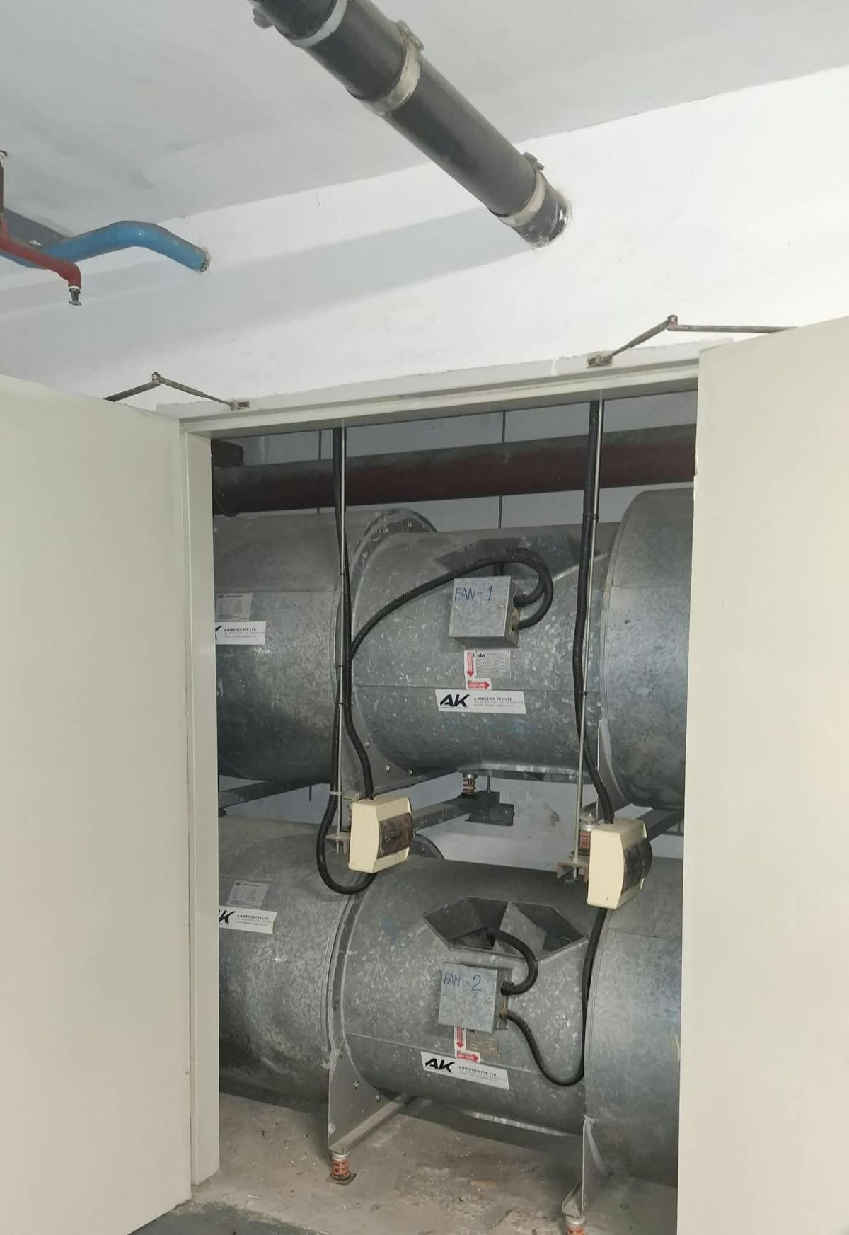 Axial mechanical ventilation fans installed in a fan room by Winsteam Engineering